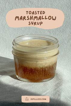 toasted marshmallow syrup in a glass jar on a white background with the words toasted marshmallow syrup above it