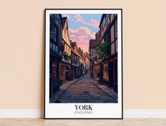 an art print of york, england on the wall in front of a brick floor