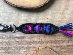 a keychain with an embroidered fish design on it