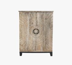 a wooden cabinet with a circular design on the front