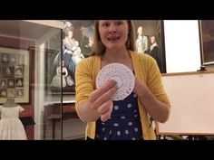 a woman holding a paper plate in her hand