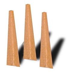 three wooden cones sitting next to each other