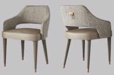 two gray chairs with gold handles on each one and the other in different colors, all facing opposite directions