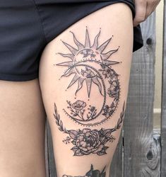 a woman's thigh with sun and moon tattoos on it