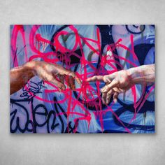 two hands reaching out to each other over graffiti