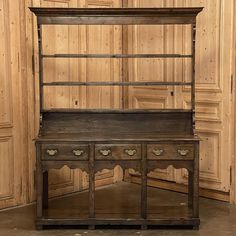 an old wooden desk with drawers and shelves