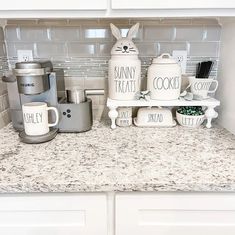 the kitchen counter is clean and ready to be used as a coffee bar or breakfast bar