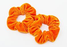 Note: This listing is for ONE hair scrunchie. Pull your hair up with this Orange Velvet Hair Scrunchie! We offer a funky twist with fun bright colors and fashion-forward prints. Tie them around your basic ponytail to spice up your style, add them to the end of your braid, or even around the base of your bun, for a splash of extra color and style. This scrunchie is made of 100% velvet! It is soft, comfortable and best of all, durable! Our scrunchies are carefully sewn and made to last. They can w Pink And Orange Hair, Orange Accessories, Handmade Favors, Orange Christmas, Hair Elastic, Scrunchie Hair, Orange Velvet, Velvet Hair, One Hair