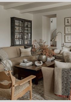 a living room filled with furniture and decor