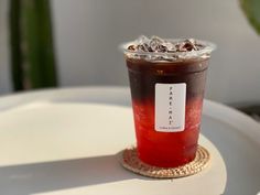 a drink sitting on top of a white table