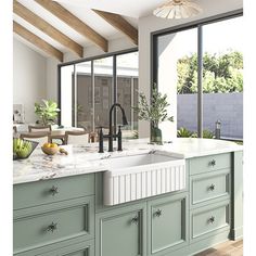 a large kitchen with green cabinets and white counter tops is pictured in this artist's rendering