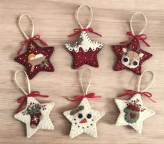 four ornaments are hanging on a table