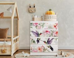 a child's room with a bed, dresser and toys