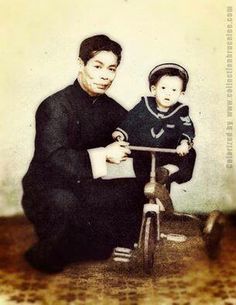 an old photo of a man and child on a bike