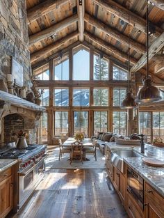 a large kitchen with wood floors and stone walls, along with an open floor plan