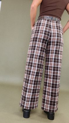 The Plaid Straight Leg Pants in Brown are a classic and stylish addition to your wardrobe. The brown color adds warmth and versatility, making them a fantastic choice for pairing with various tops, from cozy knit sweaters to chic blouses, for a fashionable and comfortable looks. Plaid pants Straight leg Button waistline Zipper closure Fabric: 100% Polyester Inseam: Rise: Small: 29.75 Small 12.25 in Medium 30 in Medium 12.50 in Large 30.25 in Large 13 in Model Specs: Emily is wearing a size small Cozy Knit Sweater, Pants Brown, Vip Group, Chic Blouses, Everyday Chic, Knit Sweaters, Pants Straight Leg, Cozy Knit, Plaid Pants