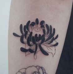 a black and white tattoo design on the arm