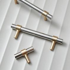 three different types of metal handles on a white surface with the words tinyhob above them