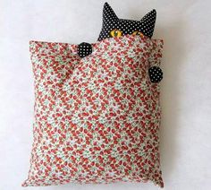 two pillows that have been made to look like cats