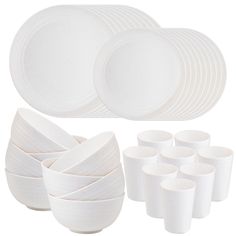 white dishes and cups are arranged on a white background