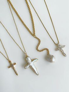 Effortlessly cool. Meet the 'ALIX' - featuring a CZ encrusted dagger pendant paired alongside 18K gold chain, this necklace will easily become a daily essential. Made with 18K gold filled chain and pendant. Waterproof & rust-free. Available in lengths 16", 18", 20", 22". Handmade with love in Los Angeles. Pearl Cross Necklace, 18k Gold Chain, Gold Cross Necklace, Diamond Cross Pendants, Diamond Cross, Creating Jewelry, Gold Cross, Gold Chain Necklace, Gold Plated Chains