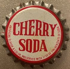 a bottle cap with the word cherry soda on it