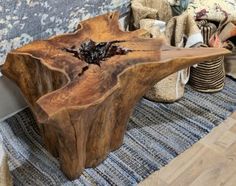 a wooden table sitting on top of a carpeted floor