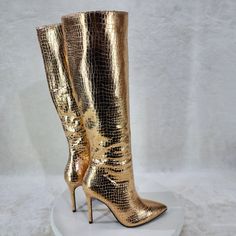 Rose Gold Metallic Festive Pointy Toe With Inseam Side Zipper Snake Skin Textured 4 Inch Stiletto Heel Brand New In Box. Chic Lace-up Party Boots, Gold Pointed Toe Party Boots, Gold High Heel Boots With Reinforced Heel, Trendy Gold Party Boots, Glamorous Gold Heeled Boots For Party, Glamorous Gold Boots For Party Season, Glamorous Gold Boots For Night Out, Gold High Heel Trendy Boots, Gold Heeled Boots With Reinforced Heel For Party