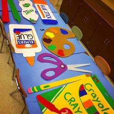 the table is covered with various crafts for children to make and use on their own