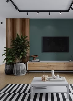 a living room with green walls and black and white striped rugs on the floor