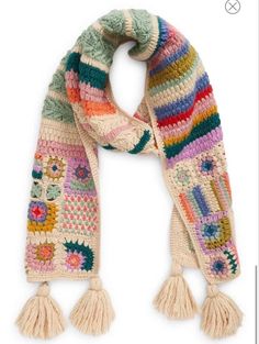 a multicolored knitted scarf with tassels