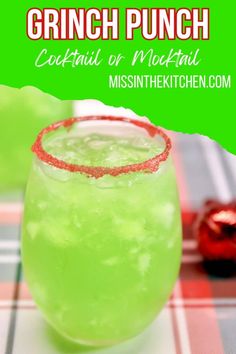 a green drink in a glass with red sprinkles on the rim and text overlay that reads grinch punch cocktail