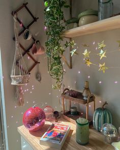 a table with some decorations on top of it and a book in the foreground