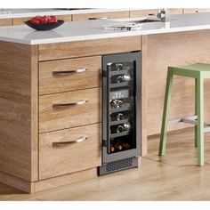 a wine cooler in the middle of a kitchen