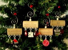 a christmas tree with wine corks hanging from it's sides and ornaments on the branches