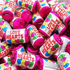 a pile of love hearts candy bars sitting on top of each other