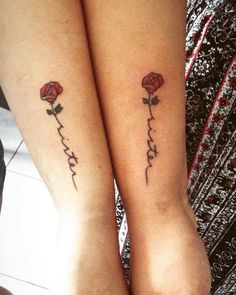 two women with matching tattoos on their legs, one is holding the other's hand