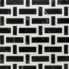 a black and white tile pattern with small squares in the middle, on top of each other