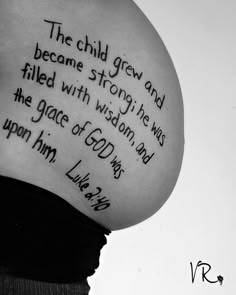 a pregnant woman's belly with the bible verse written on her side, in black and white