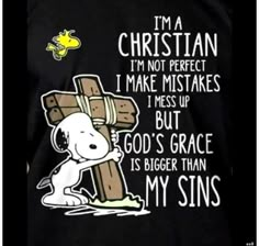 a person wearing a black shirt that says i'm a christian i'm not perfect