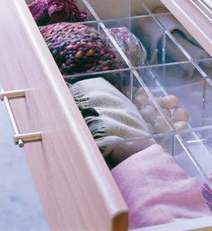 an open drawer in the middle of a bed