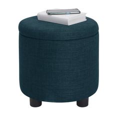 a blue ottoman with a remote control on top