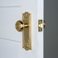 an open door with a golden handle on it