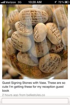 a glass jar filled with lots of rocks and writing on the inside of it's lid