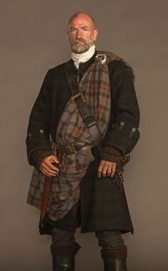 a man dressed in an old fashion outfit