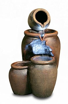 an outdoor fountain with three pots and one water feature