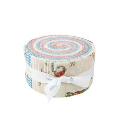 a roll of fabric with a white ribbon on it and an image of a bird in the center