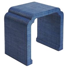 a small blue stool that is made out of fabric