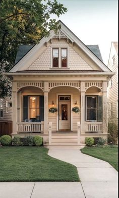 a small white house with a front porch