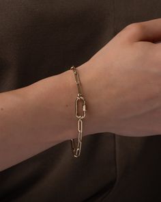 14k gold large paper clip chain with a 14k gold carabiner bracelet available in yellow, white, or rose gold & your choice of length. A modern, edgy, and timeless necklace chain. Made in L.A. Total Weight: 7'' length is approx. 4.2 grams Size of Carabiner: Approx. 9mm(W) by 18mm(H) Weight of Carabiner: Approx. 1 gram Standard Production: 10 - 15 business days Rush Order Production: 7 - 12 business days Shipping: Select shipping method at checkout Shipped from our L.A. Studio Yellow Gold Tarnish-resistant Paperclip Chain Bracelet, Gold-tone 14k Gold Paperclip Bracelet, Gold-tone Link Bracelets With Paperclip Chain, Elegant 14k Gold-filled Jewelry With Paperclip Chain, 14k Gold-filled Yellow Gold Paperclip Bracelet, Tarnish Resistant, Necklace Guide, Disc Necklace, Wedding Wear, Personalized Necklace